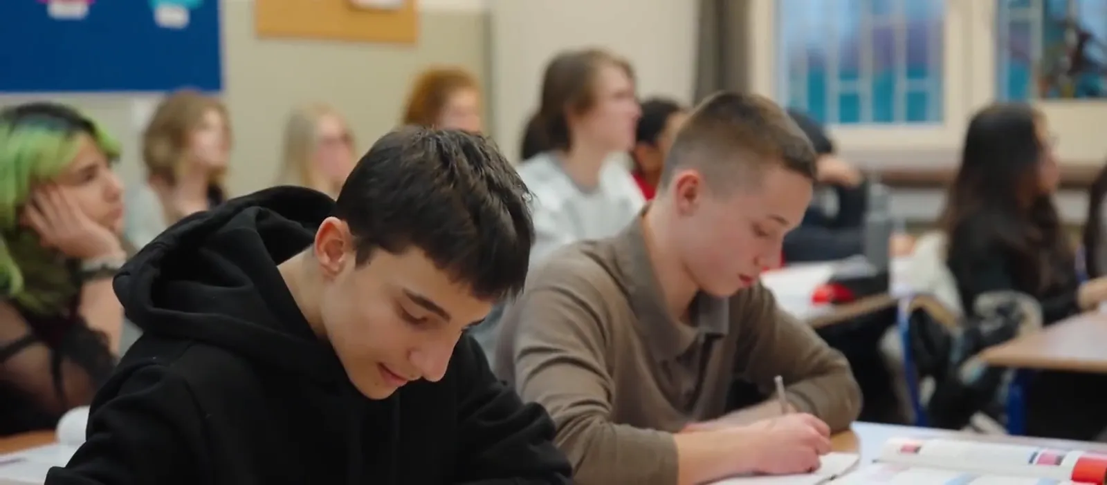 Pupils in a bright classroom at the International American School of Warsaw